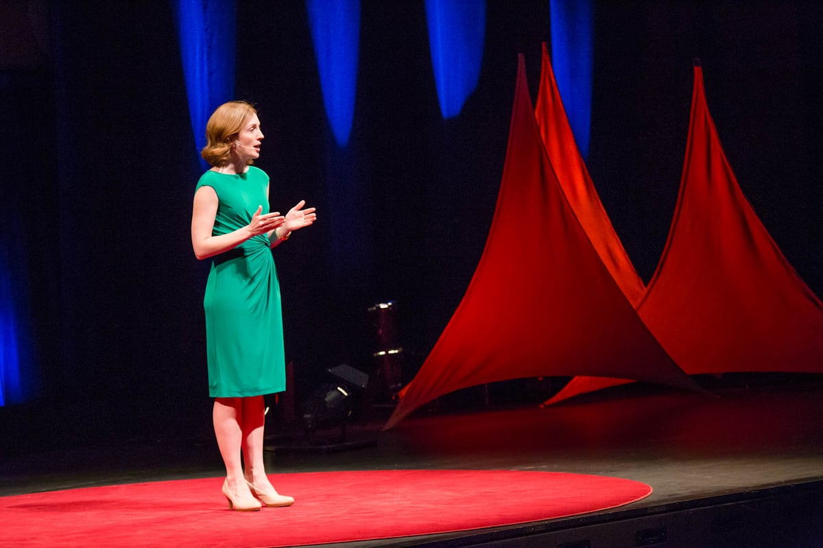 Betz presenting on stage at the 2015 TEDxMileHigh