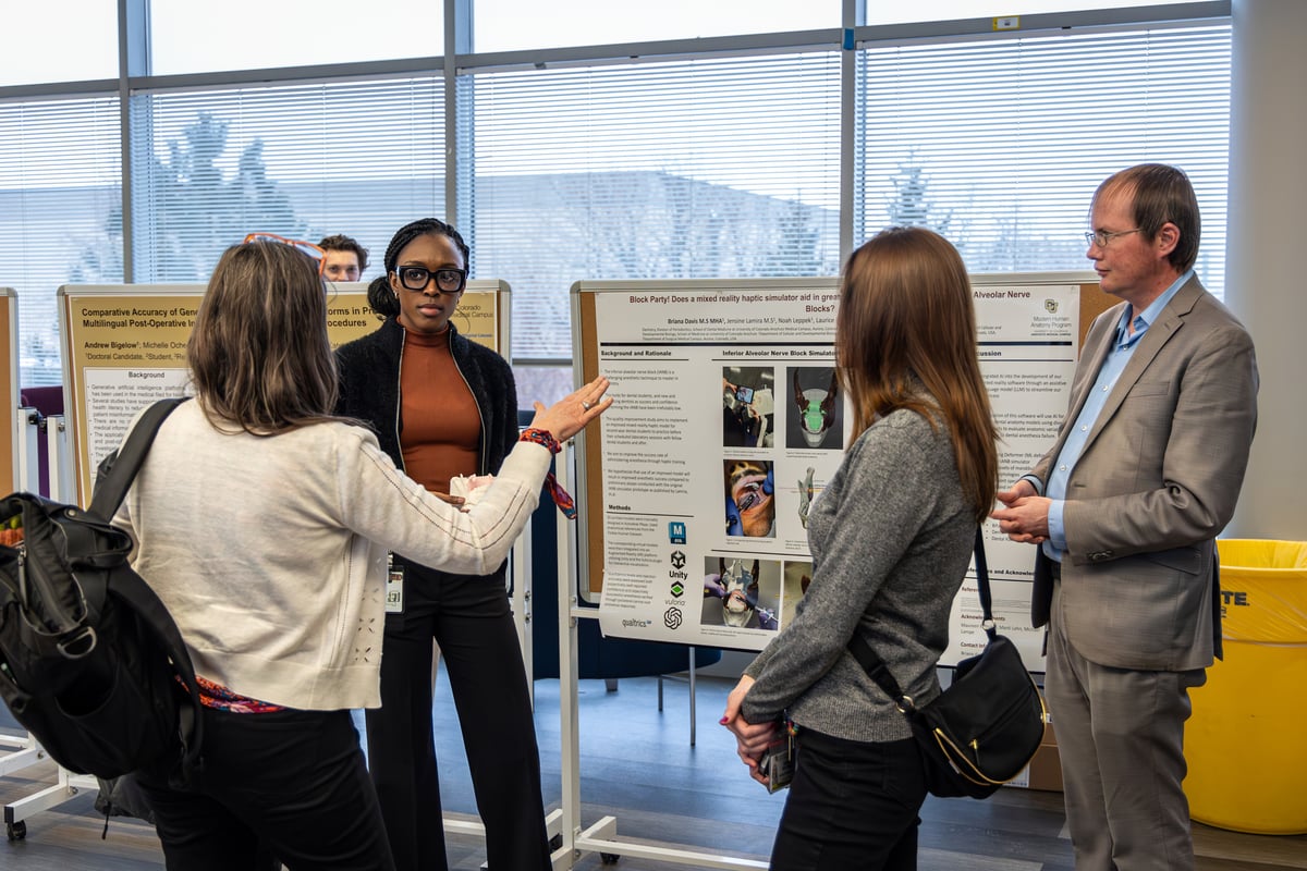 Participants at the artificial intelligence conference displayed posters that explained how they are incorporating AI in their health sciences research. 