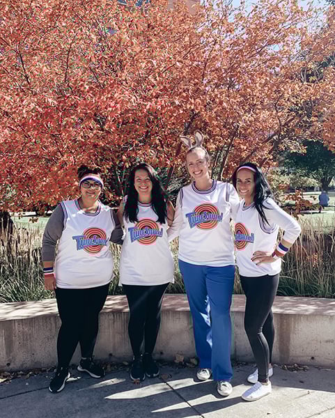 Agueda dressed as Tune Squad with coworkers for Halloween