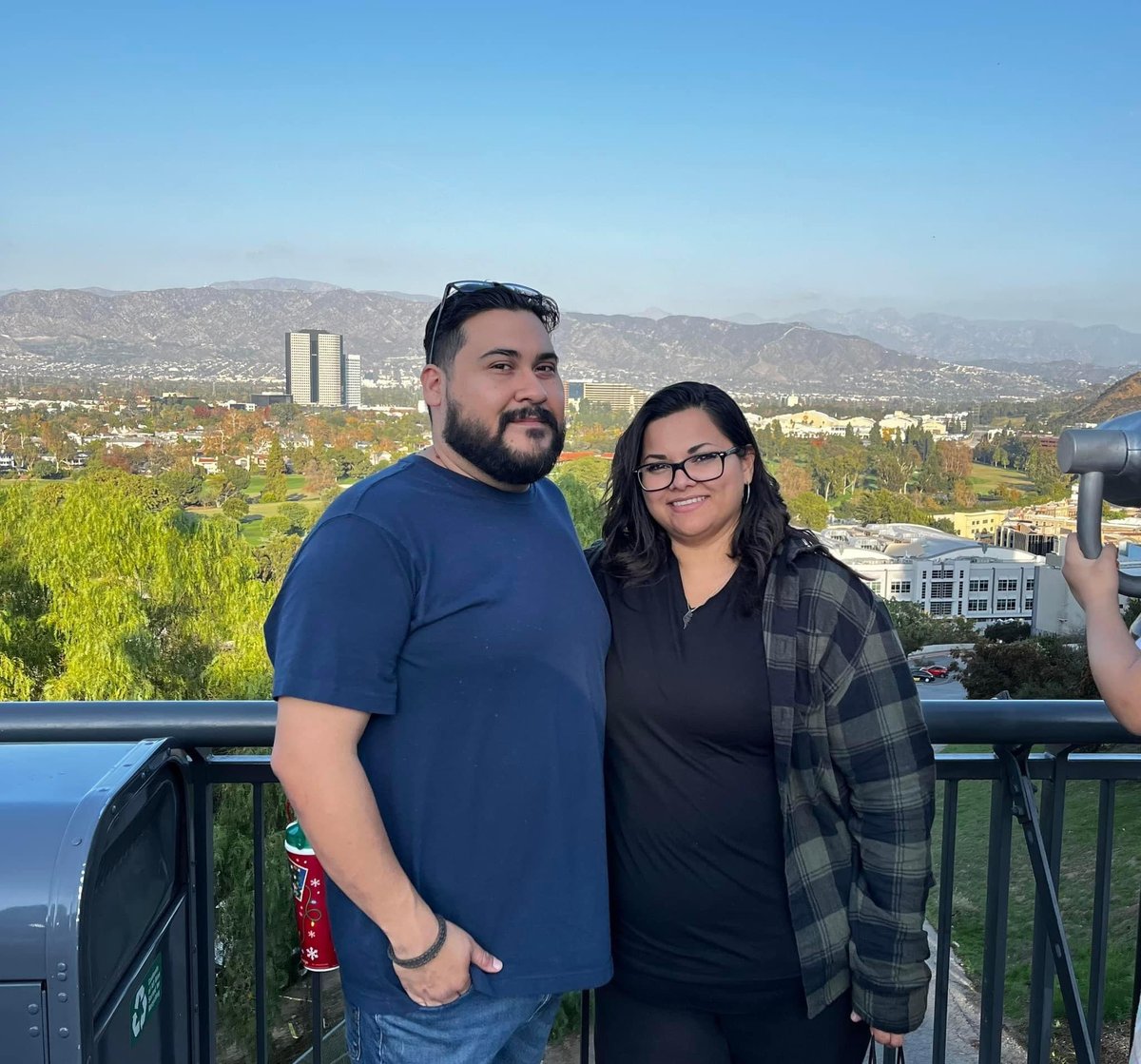 Steven and Agueda with view of mountains behind
