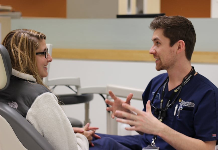 dentist speaking with patient