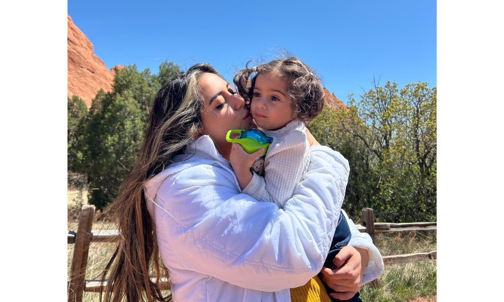 Menna Aly holding her daughter