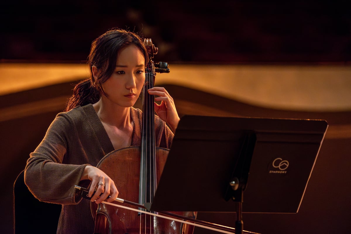 Principal Cello Seoyoen Min plays during filming of 'Never Dream Alone.'