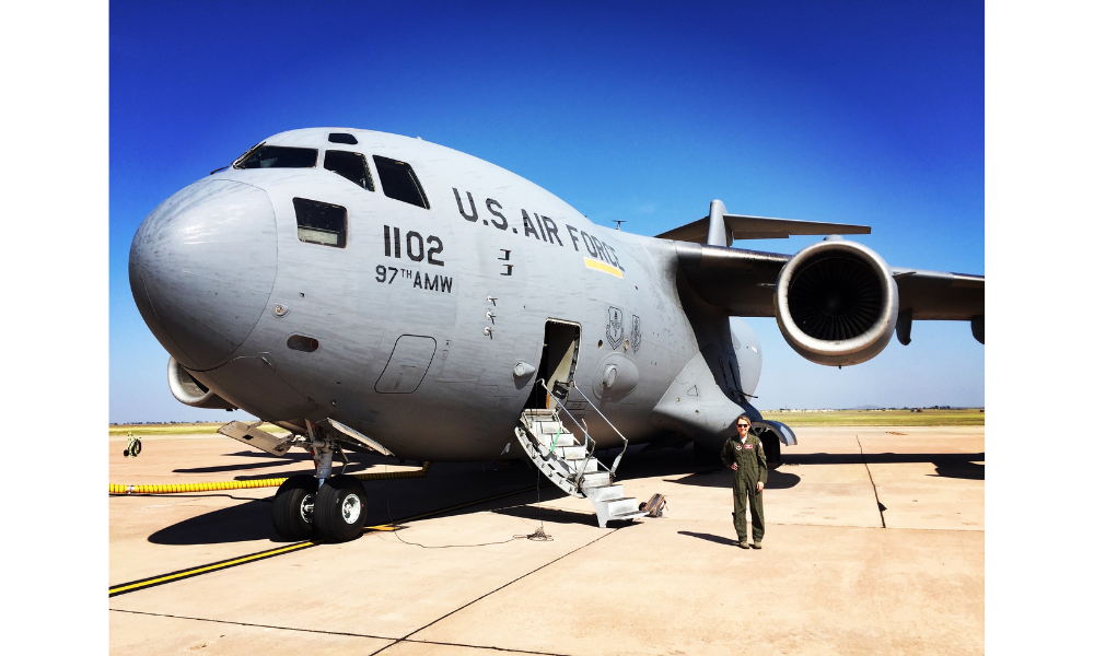 woman standing in front of Air Force plane