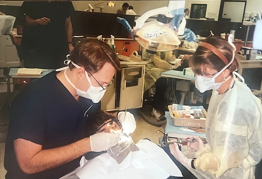 dental students work on patient
