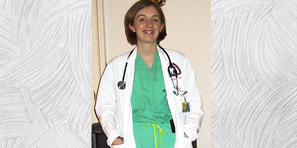 Betz smiling at camera in medical school